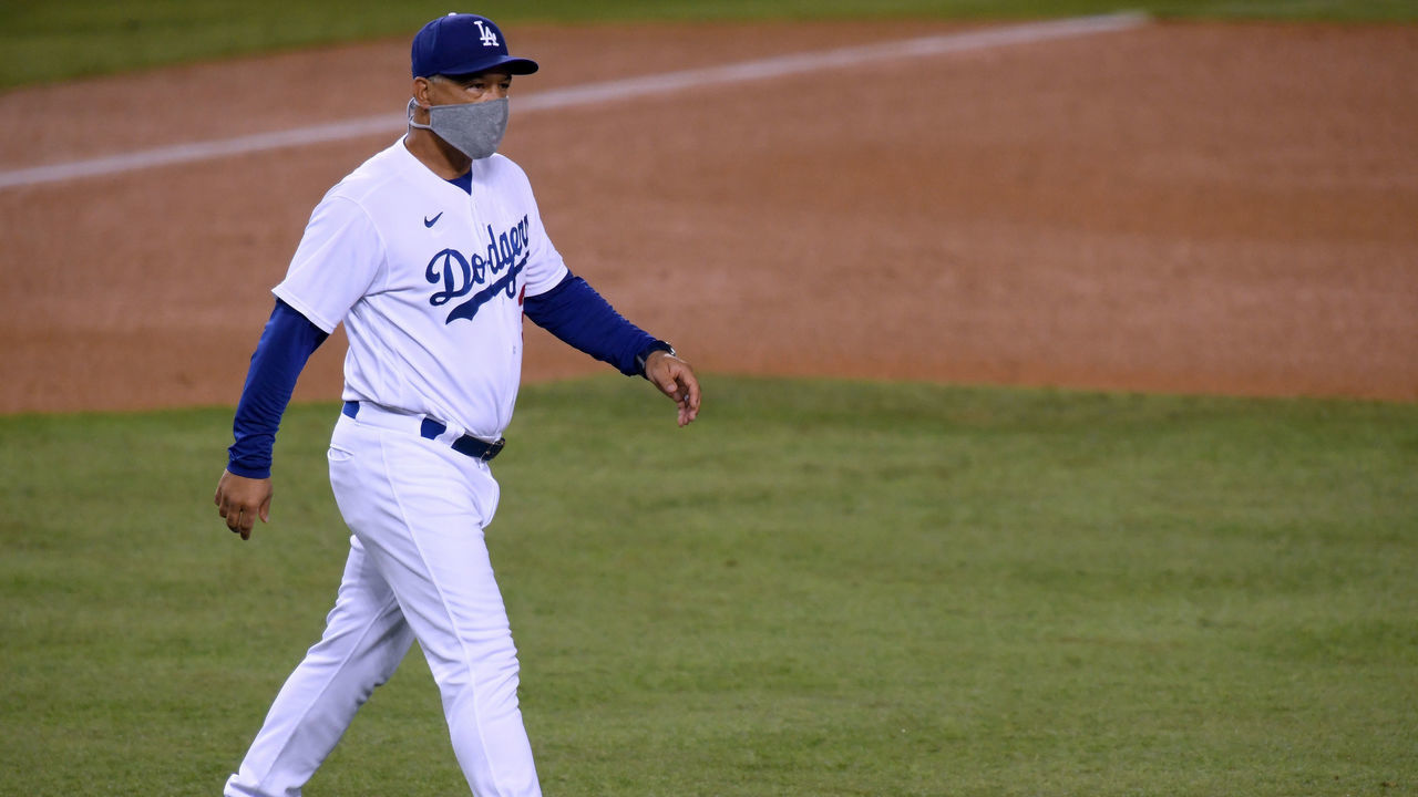 LOS ANGELES, CALIFORNIA - SEPTEMBER 22: Manager Dave Roberts makes his way to the mound for a pitching change during the sixth inning against the Oakland Athletics at Dodger Stadium on September 22, 2020 in Los Angeles, California.
