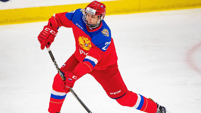 PLYMOUTH, MI - DECEMBER 11: Shakir Mukhamadullin #27 of the U17 Russian Nationals passes the puck against the Switzerland Nationals during day one of game one of the 2018 Under-17 Four Nations Tournament at USA Hockey Arena on December 11, 2018 in Plymouth, Michigan. Russia defeated Switzerland 9-1.