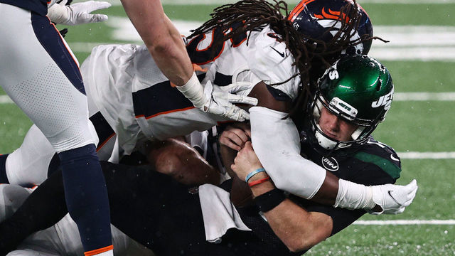 EAST RUTHERFORD, NEW JERSEY - OCTOBER 01: A.J. Johnson #45 of the Denver Broncos sacks Sam Darnold #14 of the New York Jets during the third quarter at MetLife Stadium on October 01, 2020 in East Rutherford, New Jersey.