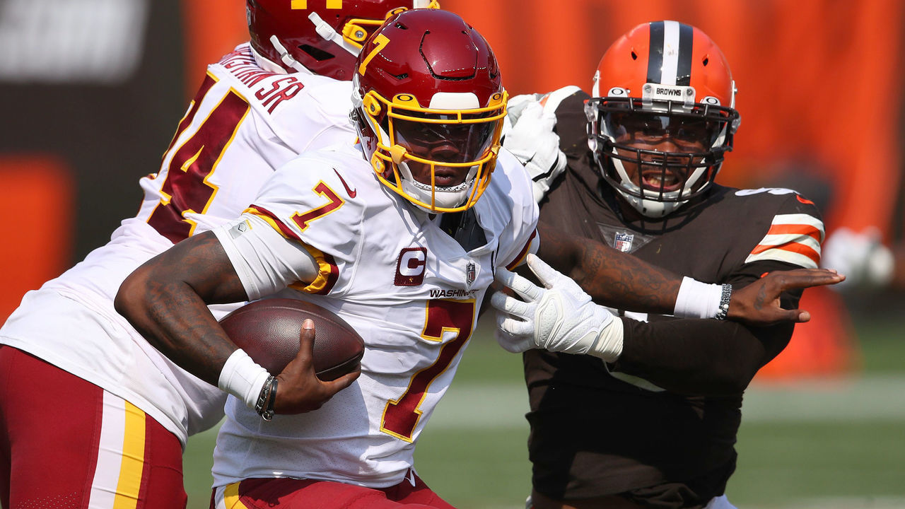 CLEVELAND, OHIO - SEPTEMBER 27: Dwayne Haskins #7 of the Washington Football Team tries to avoid a tackle while playing the Cleveland Browns at FirstEnergy Stadium on September 27, 2020 in Cleveland, Ohio. Cleveland won the game 34-20.
