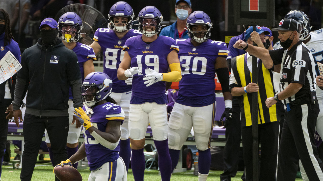 MINNEAPOLIS, MN - SEPTEMBER 27: Dalvin Cook #33 of the Minnesota Vikings holds the ball after a play in the second quarter of the game against the Tennessee Titans at U.S. Bank Stadium on September 27, 2020 in Minneapolis, Minnesota.