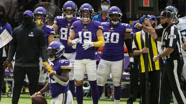 MINNEAPOLIS, MN - SEPTEMBER 27: Dalvin Cook #33 of the Minnesota Vikings holds the ball after a play in the second quarter of the game against the Tennessee Titans at U.S. Bank Stadium on September 27, 2020 in Minneapolis, Minnesota.