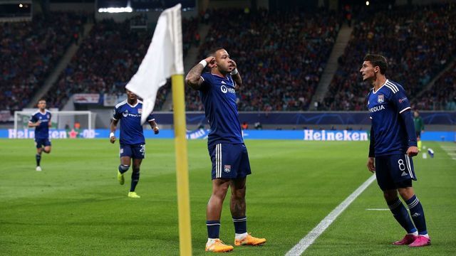 Lyon's Dutch forward Memphis Depay (L) celebrates scoring the opening goal with Lyon's French midfielder Houssem Aouar (R) during the UEFA Champions League Group G football match RB Leipzig v Olympique Lyonnais (OL) in Leipzig, eastern Germany, on October 2, 2019.
