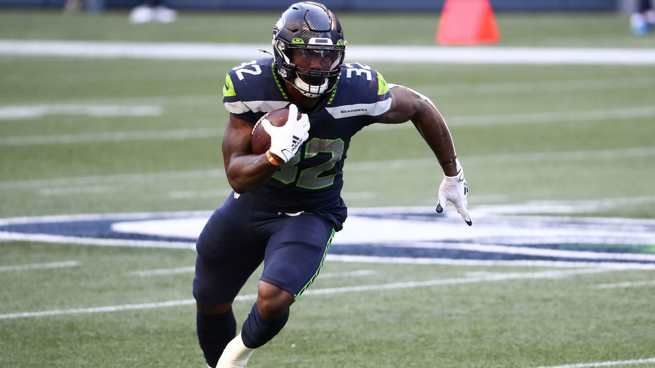 SEATTLE, WASHINGTON - SEPTEMBER 20: Chris Carson #32 of the Seattle Seahawks runs with the ball in the first quarter against the New England Patriots at CenturyLink Field on September 20, 2020 in Seattle, Washington.