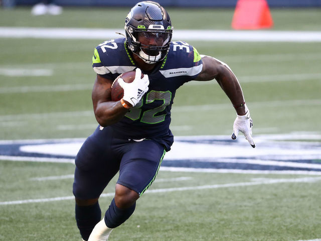 SEATTLE, WASHINGTON - SEPTEMBER 20: Chris Carson #32 of the Seattle Seahawks runs with the ball in the first quarter against the New England Patriots at CenturyLink Field on September 20, 2020 in Seattle, Washington.