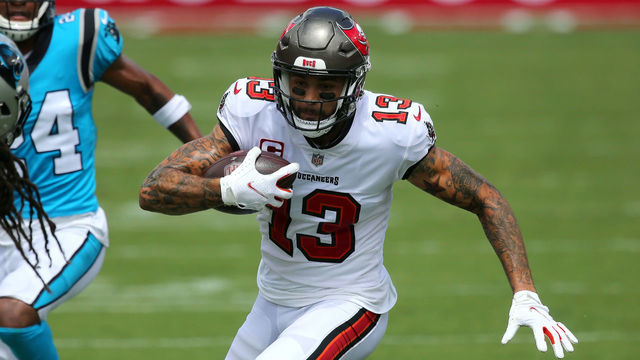 TAMPA, FL - SEP 20: Mike Evans (13) of the Bucs runs with the ball after making the catch during the regular season game between the Carolina Panthers and the Tampa Bay Buccaneers on September 20, 2020 at Raymond James Stadium in Tampa, Florida.