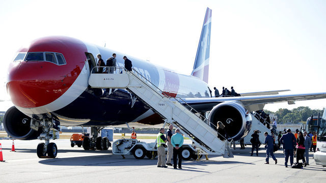 WARWICK, RI - OCTOBER 4: Members of the New England Patriots board the team's customized Boeing 767 prior to its inaugural flight at T.F. Green Airport in Warwick, RI on Oct. 4, 2017. The team was headed to Florida to face the Tampa Bay Buccaneers.