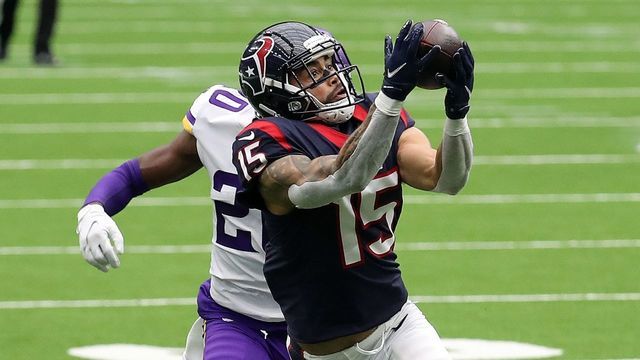 HOUSTON, TEXAS - OCTOBER 04: Will Fuller #15 of the Houston Texans makes a catch as Jeff Gladney #20 of the Minnesota Vikings defends during the third quarter at NRG Stadium on October 04, 2020 in Houston, Texas.