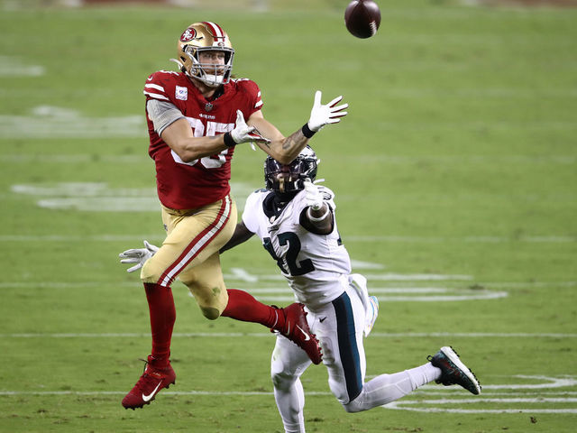 SANTA CLARA, CALIFORNIA - OCTOBER 04: George Kittle #85 of the San Francisco 49ers makes a catch against K'Von Wallace #42 of the Philadelphia Eagles in the third quarter of the game at Levi's Stadium on October 04, 2020 in Santa Clara, California.