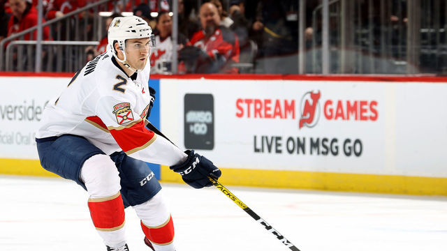 NEWARK, NEW JERSEY - FEBRUARY 11: Josh Brown #2 of the Florida Panthers passes the puck in the third period against the New Jersey Devils at Prudential Center on February 11, 2020 in Newark, New Jersey.The Florida Panthers defeated the New Jersey Devils 5-3.