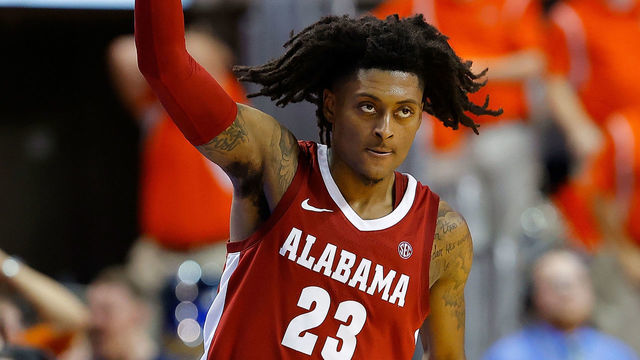 AUBURN, ALABAMA - FEBRUARY 12: John Petty Jr. #23 of the Alabama Crimson Tide reacts after hitting a three-point basket in the second half against the Auburn Tigers at Auburn Arena on February 12, 2020 in Auburn, Alabama.
