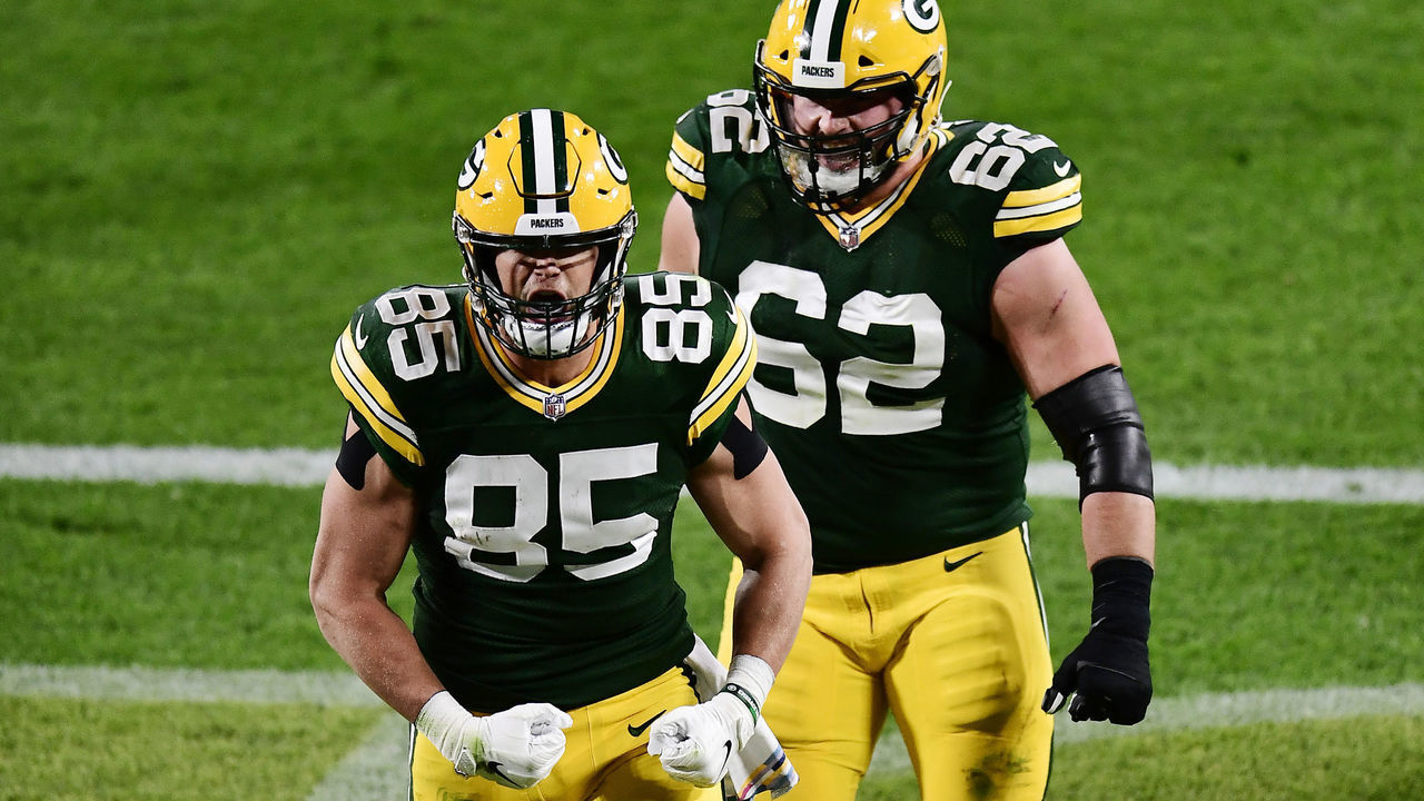 GREEN BAY, WISCONSIN - OCTOBER 05: Robert Tonyan #85 of the Green Bay Packers celebrates with Lucas Patrick #62 after scoring a touchdown during the second quarter against the Atlanta Falcons at Lambeau Field on October 05, 2020 in Green Bay, Wisconsin.