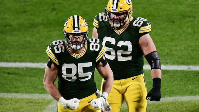 GREEN BAY, WISCONSIN - OCTOBER 05: Robert Tonyan #85 of the Green Bay Packers celebrates with Lucas Patrick #62 after scoring a touchdown during the second quarter against the Atlanta Falcons at Lambeau Field on October 05, 2020 in Green Bay, Wisconsin.