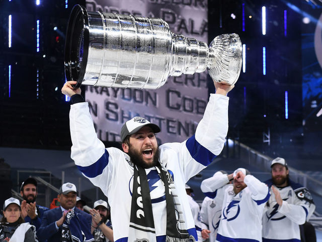 EDMONTON, ALBERTA - SEPTEMBER 28: Tyler Johnson #9 of the Tampa Bay Lightning hoists the Stanley Cup overhead after the Tampa Bay Lightning defeated the Dallas Stars 2-0 in Game Six of the NHL Stanley Cup Final to win the best of seven game series 4-2 at Rogers Place on September 28, 2020 in Edmonton, Alberta, Canada.