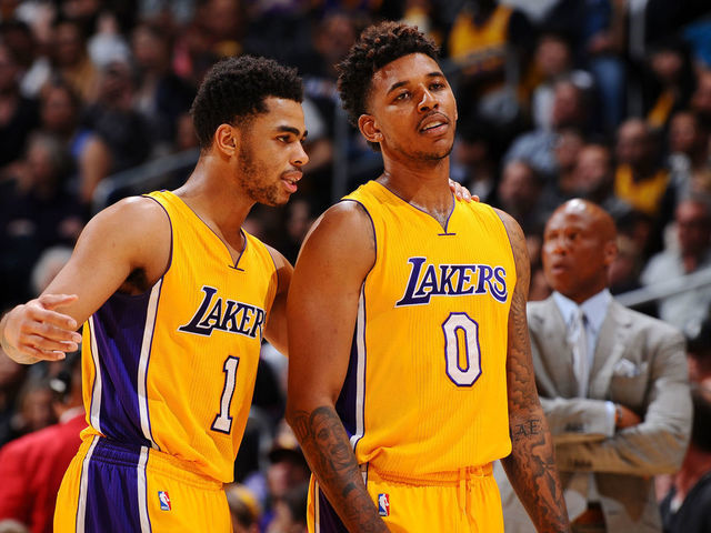 LOS ANGELES, CA - FEBRUARY 19: D'Angelo Russell #1 of the Los Angeles Lakers and Nick Young #0 of the Los Angeles Lakers talk during the game against the San Antonio Spurs on February 19, 2016 at STAPLES Center in Los Angeles, California. NOTE TO USER: User expressly acknowledges and agrees that, by downloading and/or using this Photograph, user is consenting to the terms and conditions of the Getty Images License Agreement. Mandatory Copyright Notice: Copyright 2016 NBAE