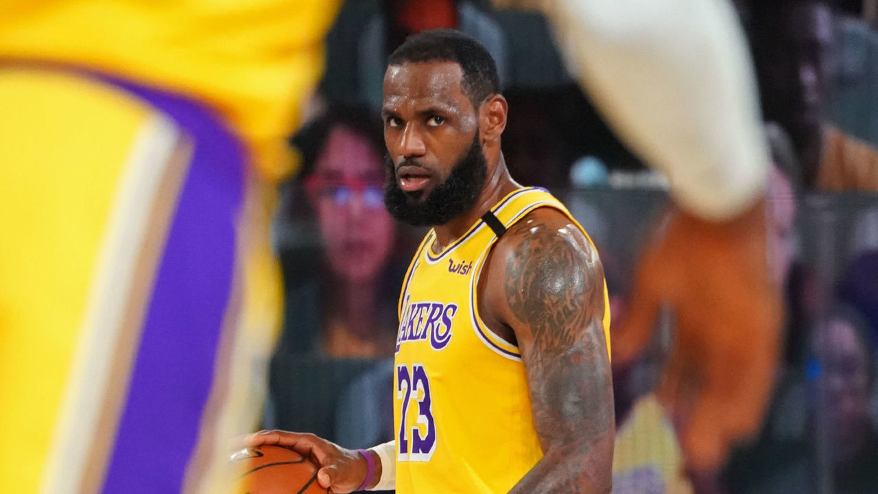 ORLANDO, FL - OCTOBER 06: LeBron James #23 of the Los Angeles Lakers looks on and dribbles the ball up court during Game Four of the NBA Finals against the Miami Heat on October 6, 2020 in Orlando, Florida at AdventHealth Arena. NOTE TO USER: User expressly acknowledges and agrees that, by downloading and/or using this Photograph, user is consenting to the terms and conditions of the Getty Images License Agreement. Mandatory Copyright Notice: Copyright 2020 NBAE