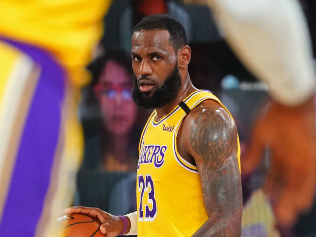 ORLANDO, FL - OCTOBER 06: LeBron James #23 of the Los Angeles Lakers looks on and dribbles the ball up court during Game Four of the NBA Finals against the Miami Heat on October 6, 2020 in Orlando, Florida at AdventHealth Arena. NOTE TO USER: User expressly acknowledges and agrees that, by downloading and/or using this Photograph, user is consenting to the terms and conditions of the Getty Images License Agreement. Mandatory Copyright Notice: Copyright 2020 NBAE