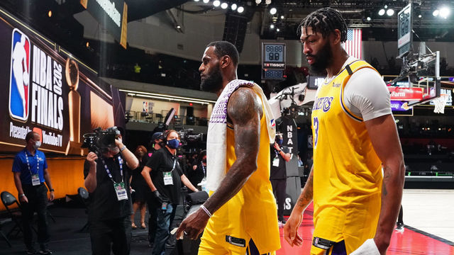 ORLANDO, FL - OCTOBER 06: LeBron James #23 and Anthony Davis #3 of the Los Angeles Lakers walk off the court after Game Four of the NBA Finals against the Miami Heat on October 6, 2020 in Orlando, Florida at AdventHealth Arena. NOTE TO USER: User expressly acknowledges and agrees that, by downloading and/or using this Photograph, user is consenting to the terms and conditions of the Getty Images License Agreement. Mandatory Copyright Notice: Copyright 2020 NBAE