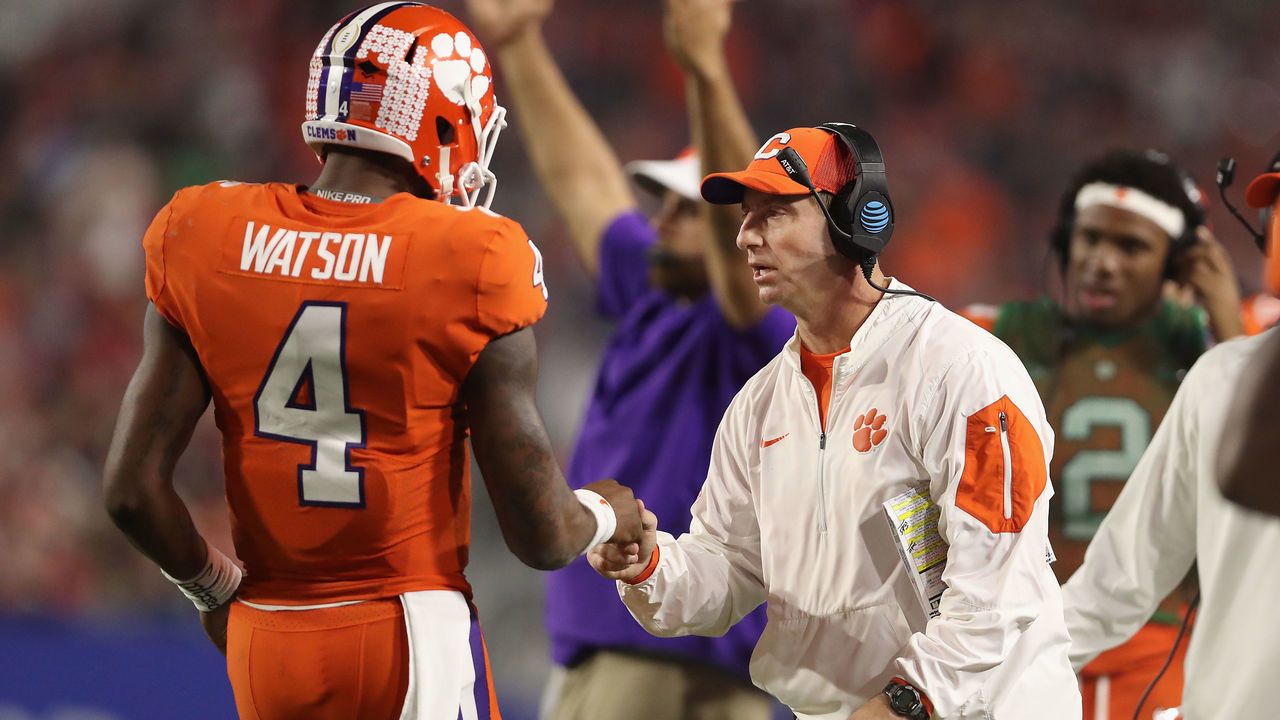GLENDALE, AZ - DECEMBER 31: Head coach Dabo Swinney (R) of the Clemson Tigers congraulates quarterback Deshaun Watson #4 after he scored on a one yard rushing touchdown against the Ohio State Buckeyes during the Playstation Fiesta Bowl at University of Phoenix Stadium on December 31, 2016 in Glendale, Arizona. The Tigers defeated the Buckeyes 31-0.