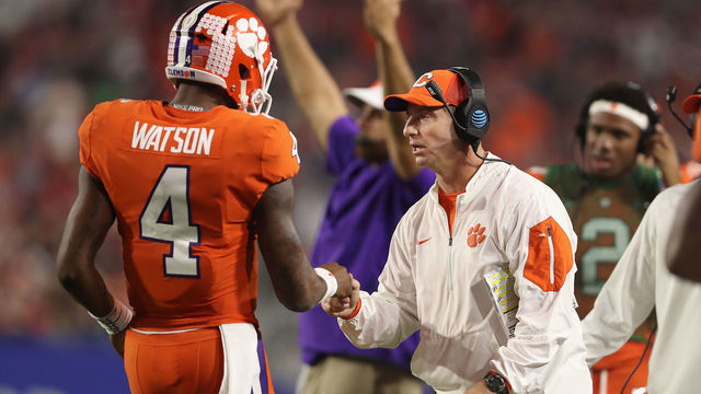 GLENDALE, AZ - DECEMBER 31: Head coach Dabo Swinney (R) of the Clemson Tigers congraulates quarterback Deshaun Watson #4 after he scored on a one yard rushing touchdown against the Ohio State Buckeyes during the Playstation Fiesta Bowl at University of Phoenix Stadium on December 31, 2016 in Glendale, Arizona. The Tigers defeated the Buckeyes 31-0.