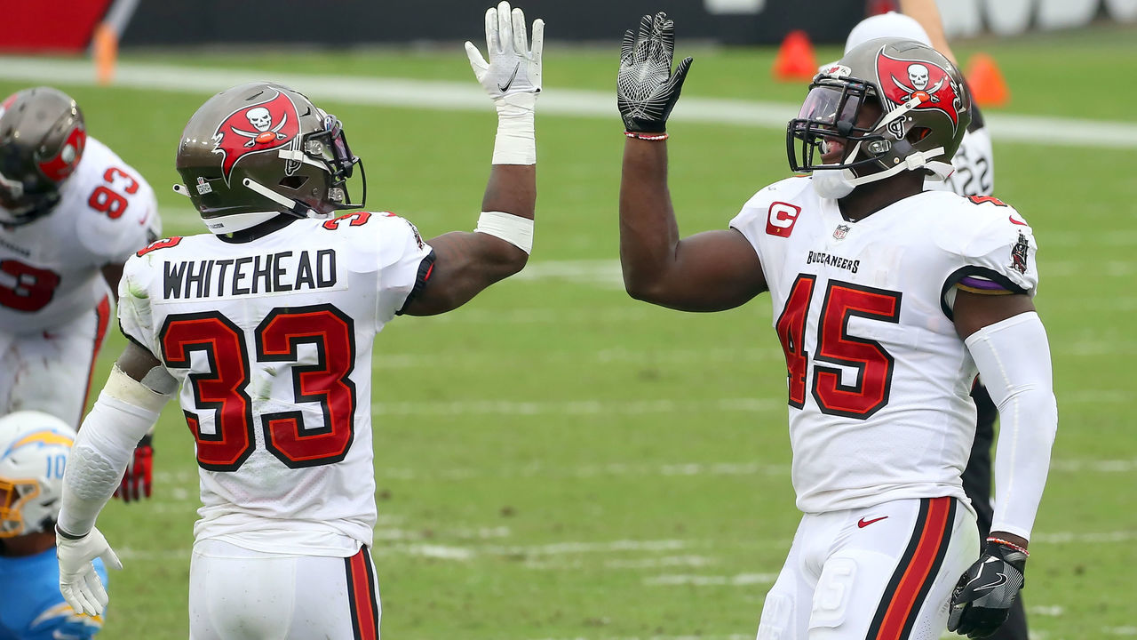 TAMPA, FL - OCTOBER 04: Jordan Whitehead (33) and Devin White (45) of the Buccaneers celebrates a defensive stop during the regular season game between the Los Angeles Chargers and the Tampa Bay Buccaneers on October 04, 2020 at Raymond James Stadium in Tampa, Florida.