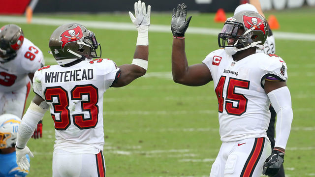 TAMPA, FL - OCTOBER 04: Jordan Whitehead (33) and Devin White (45) of the Buccaneers celebrates a defensive stop during the regular season game between the Los Angeles Chargers and the Tampa Bay Buccaneers on October 04, 2020 at Raymond James Stadium in Tampa, Florida.