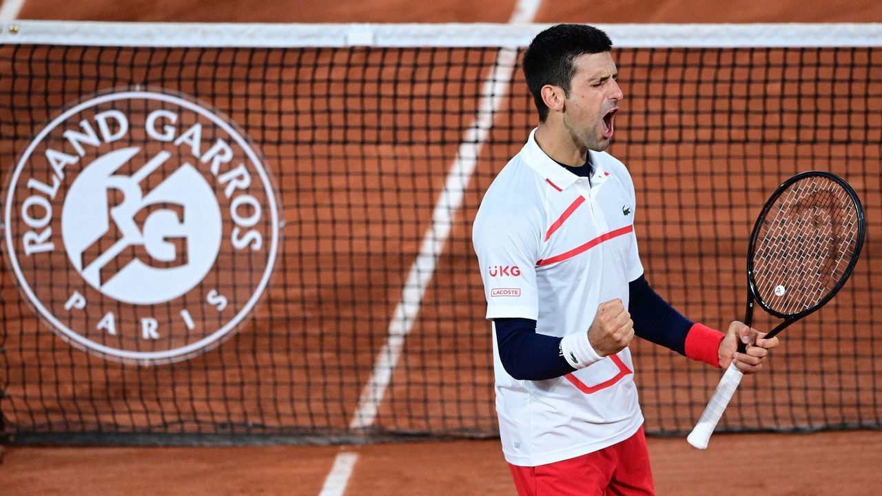 Serbia's Novak Djokovic celebrates after winning against Spain's Pablo Carreno Busta during their men's singles quarter-final tennis match on Day 11 of The Roland Garros 2020 French Open tennis tournament in Paris on October 7, 2020.