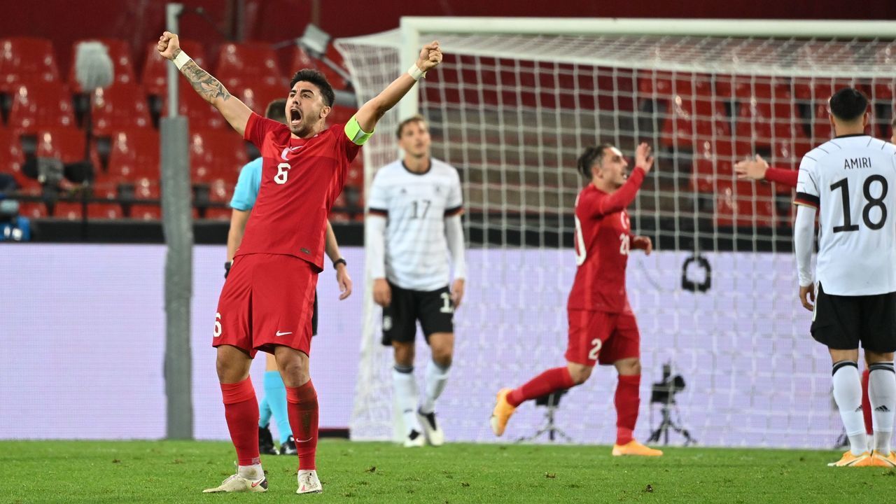 Turkey's midfielder Ozan Tufan celebrates the 3-3 goal for Turkey by Turkey's forward Kenan Karaman during the international friendly football match between Germany and Turkey in Cologne, western Germany, on October 7, 2020. - The match ended in a 3-3 draw.