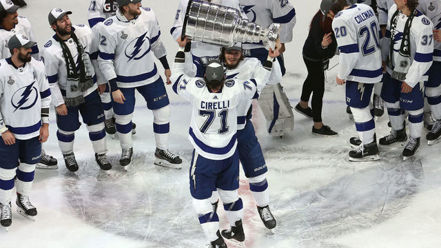 EDMONTON, ALBERTA - SEPTEMBER 28: Anthony Cirelli #71 of the Tampa Bay Lightning hands off the Stanley Cup to Mikhail Sergachev #98 following the series-winning victory over the Dallas Stars in Game Six of the 2020 NHL Stanley Cup Final at Rogers Place on September 28, 2020 in Edmonton, Alberta, Canada.