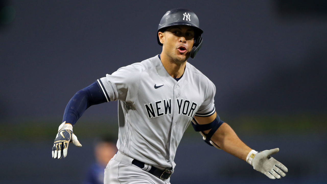 SAN DIEGO, CA - OCTOBER 06: Giancarlo Stanton #27 of the New York Yankees rounds the bases after hitting a three-run home run in the fourth inning during Game 2 of the ALDS between the New York Yankees and the Tampa Bay Rays at Petco Park on Tuesday, October 6, 2020 in San Diego, California.