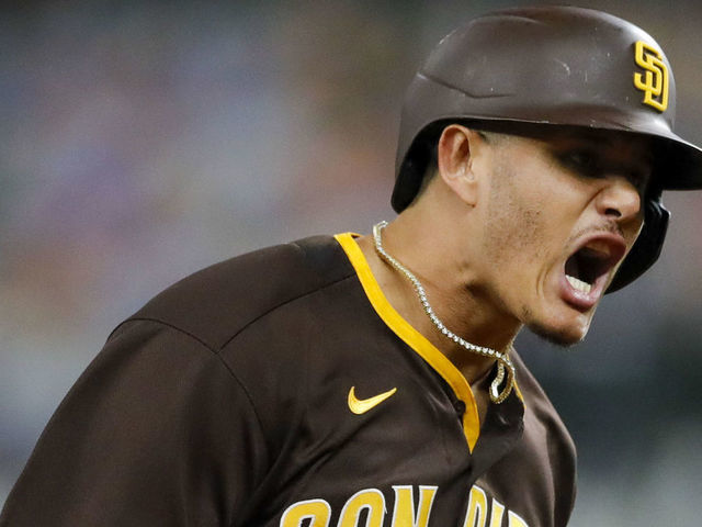 Manny Machado of the San Diego Padres celebrates after hitting an