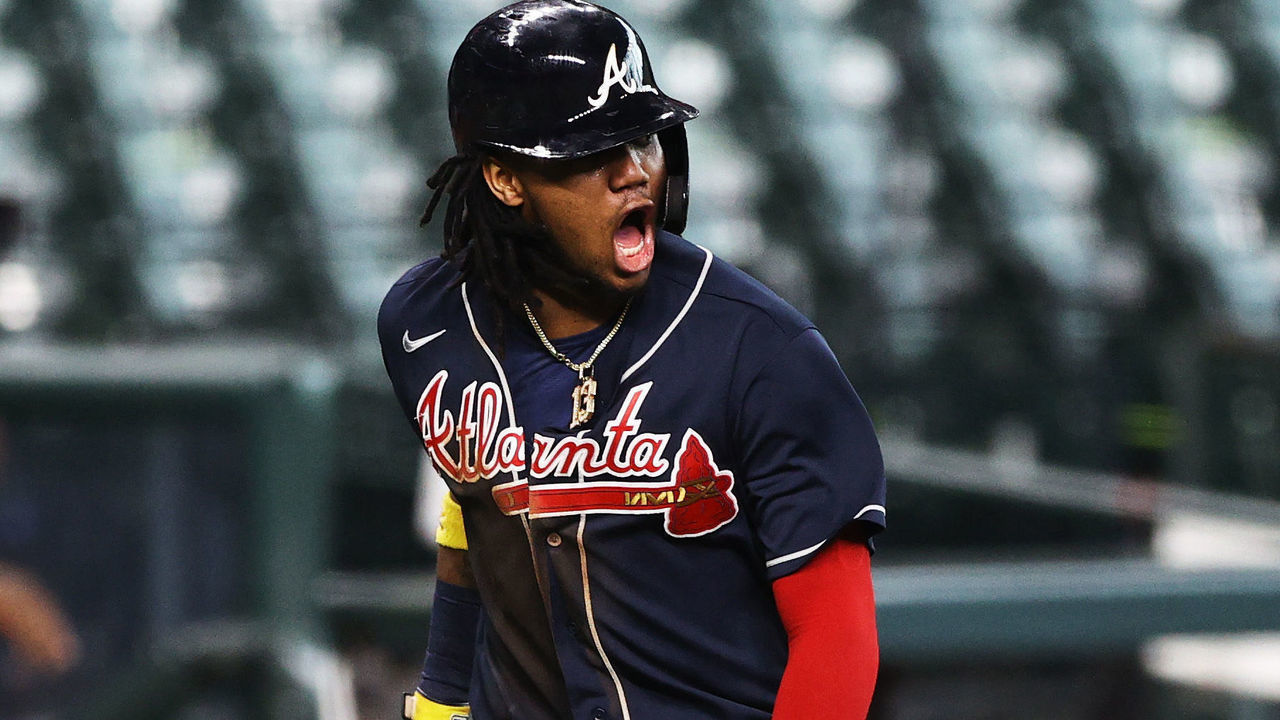 HOUSTON, TEXAS - OCTOBER 08: Ronald Acuna Jr. #13 of the Atlanta Braves celebrates scoring a run on a single by Marcell Ozuna #20 during the third inning against the Miami Marlins in Game Three of the National League Division Series at Minute Maid Park on October 08, 2020 in Houston, Texas.
