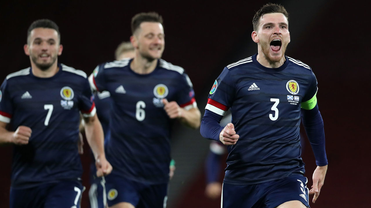 GLASGOW, SCOTLAND - OCTOBER 08: Andy Robertson of Scotland celebrates after his teams victory in the penalty shoot out during the UEFA EURO 2020 Play-Off semi-finals match between Scotland and Israel at Hampden Park on October 08, 2020 in Glasgow, Scotland. Football Stadiums around Europe remain empty due to the Coronavirus Pandemic as Government social distancing laws prohibit fans inside venues resulting in fixtures being played behind closed doors.