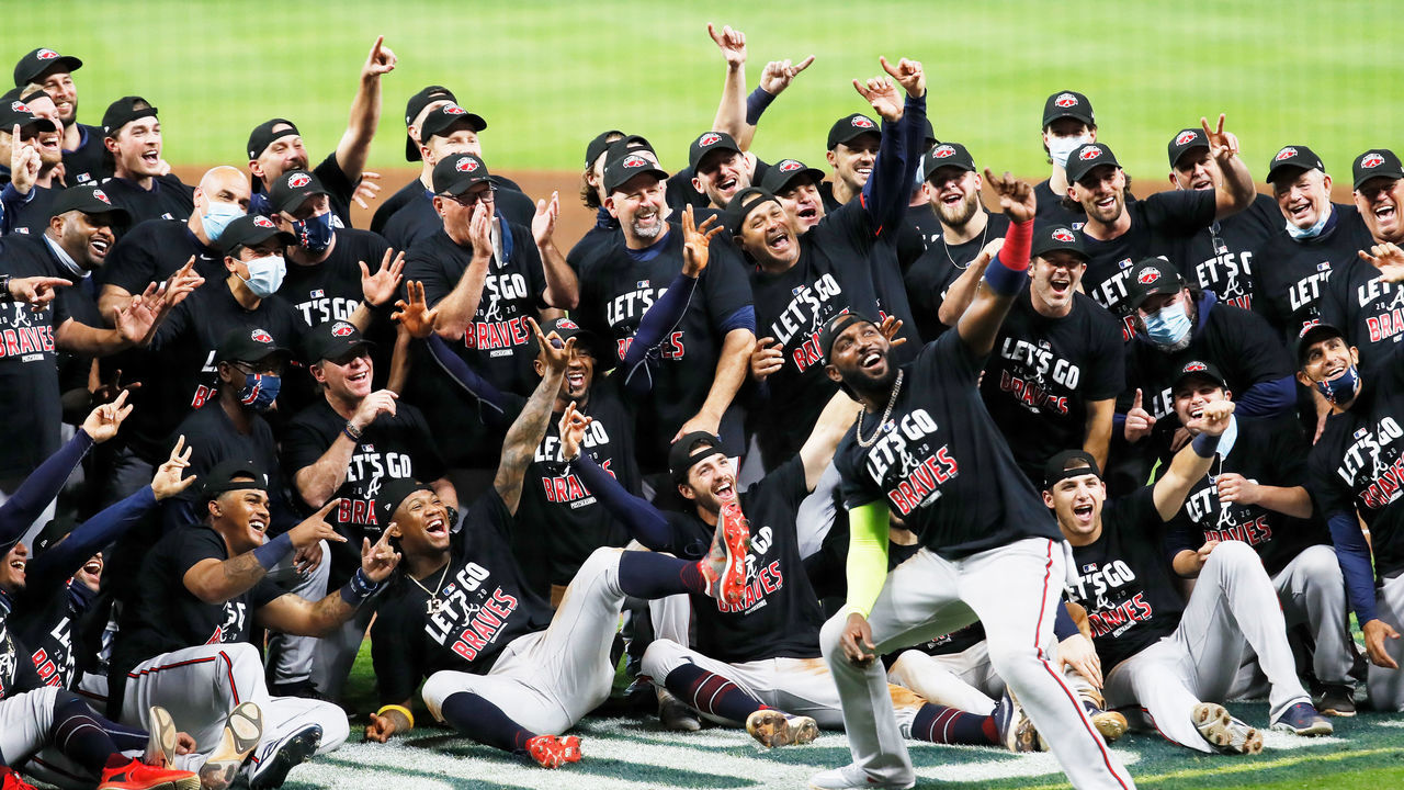 HOUSTON, TEXAS - OCTOBER 08: Marcell Ozuna #20 of the Atlanta Braves and teammates celebrate their 7 to 0 win over the Miami Marlins in Game Three of the National League Division Series at Minute Maid Park on October 08, 2020 in Houston, Texas.