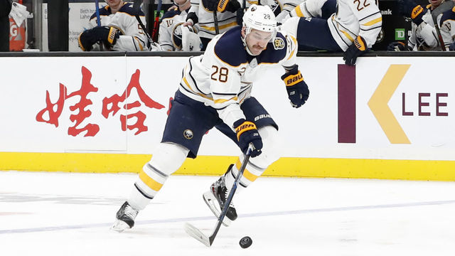 BOSTON, MA - NOVEMBER 21: Buffalo Sabres winger Zemgus Girgensons (28) takes off on a breakaway during a game between the Boston Bruins and the Buffalo Sabres on November 21, 2019, at TD Garden in Boston, Massachusetts.