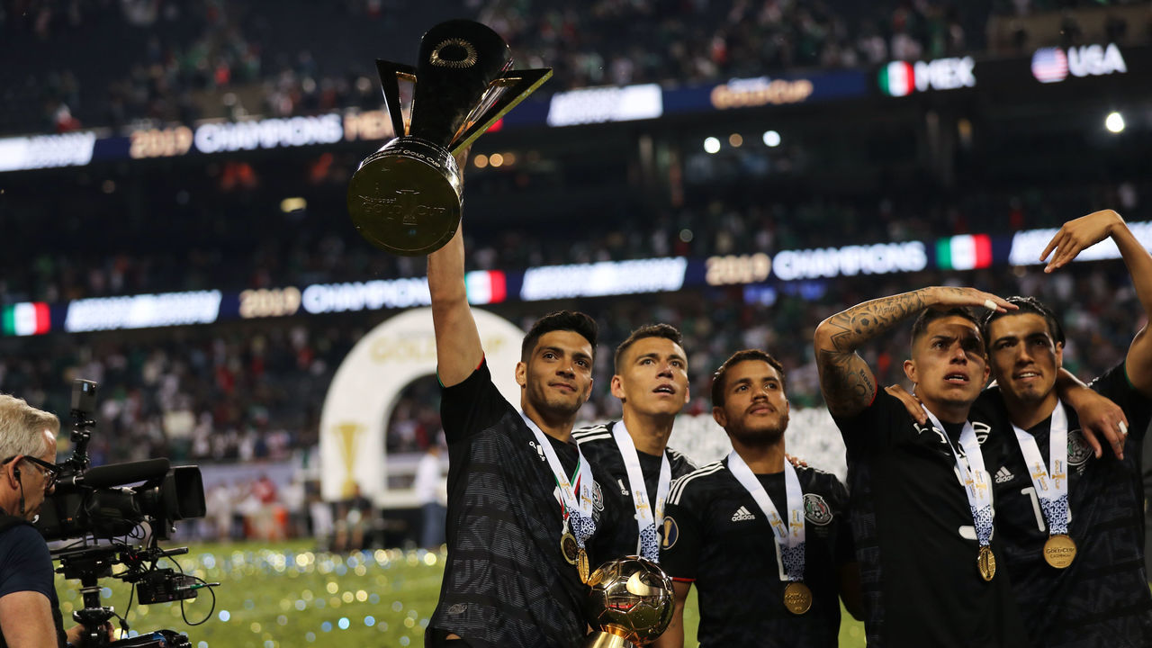 CHICAGO, IL - JULY 07: Raul Jimenez of Mexico celebrates with the CONCACAF Gold Cup trophy with teammates during the 2019 CONCACAF Gold Cup Final between Mexico and United States of America at Soldier Field on July 7, 2019 in Chicago, Illinois.
