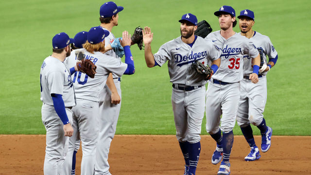 ARLINGTON, TEXAS - OCTOBER 08: Chris Taylor #3 of the Los Angeles Dodgers celebrates with teammates after defeating the San Diego Padres 12-3 in Game Three of the National League Division Series to advance to the National League Championship Series at Globe Life Field on October 08, 2020 in Arlington, Texas.