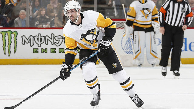 NEWARK, NJ - MARCH 10: Justin Schultz #4 of the Pittsburgh Penguins plays the puck against the New Jersey Devils during the game at the Prudential Center on March 10, 2020 in Newark, New Jersey. "n"n"n