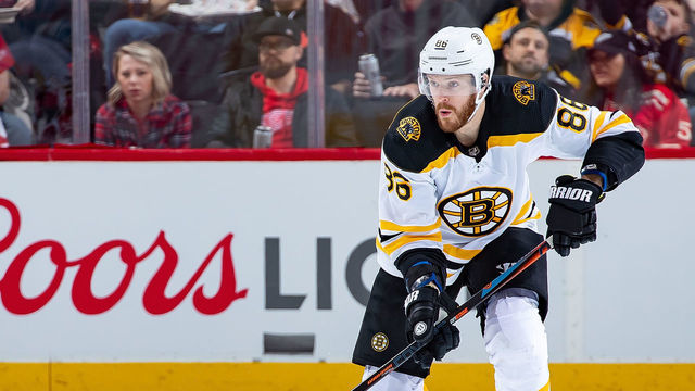 DETROIT, MI - MARCH 31: Kevan Miller #86 of the Boston Bruins skates up ice with the puck against the Detroit Red Wings during an NHL game at Little Caesars Arena on March 31, 2019 in Detroit, Michigan. Detroit defeated Boston 6-3.