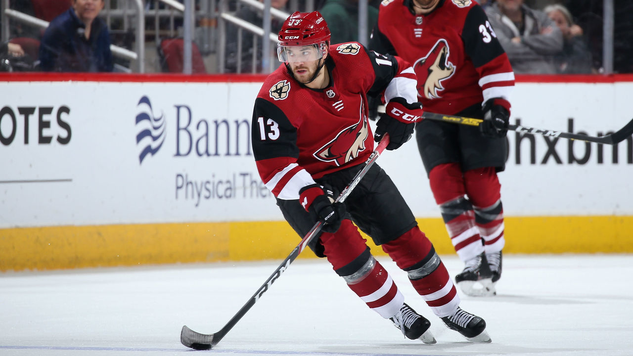 GLENDALE, ARIZONA - FEBRUARY 17: Vinnie Hinostroza #13 of the Arizona Coyotes skates with the puck during the third period of the NHL game against the New York Islanders at Gila River Arena on February 17, 2020 in Glendale, Arizona. The Coyotes defeated the Islanders 2-1.