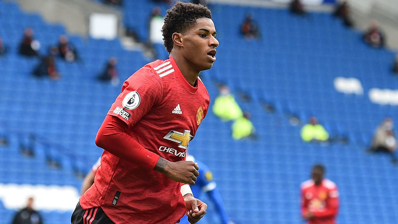 Manchester United's English striker Marcus Rashford celebrates after he scores his team's second goal during the English Premier League football match between Brighton and Hove Albion and Manchester United at the American Express Community Stadium in Brighton, southern England on September 26, 2020.