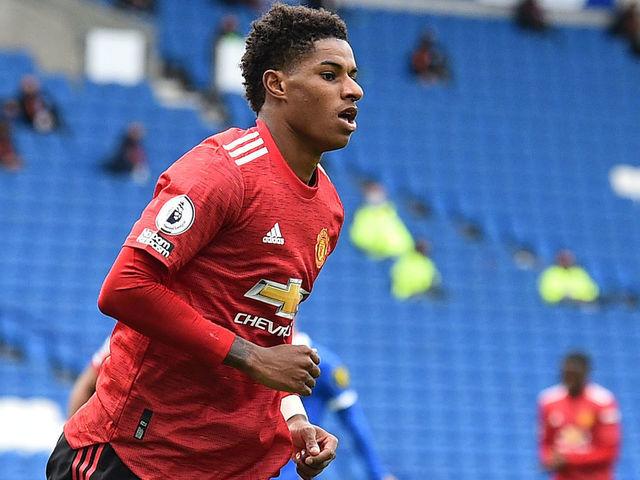 Manchester United's English striker Marcus Rashford celebrates after he scores his team's second goal during the English Premier League football match between Brighton and Hove Albion and Manchester United at the American Express Community Stadium in Brighton, southern England on September 26, 2020.
