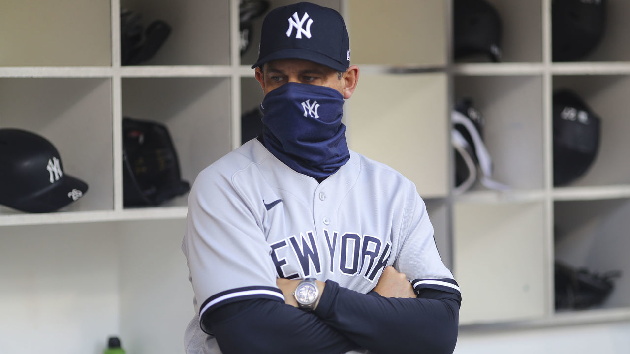 SAN DIEGO, CA - OCTOBER 09: Aaron Boone manager of the New York Yankees looks on from the dugout prior to Game 5 of the ALDS between the New York Yankees and the Tampa Bay Rays at Petco Park on Friday, October 9, 2020 in San Diego, California.