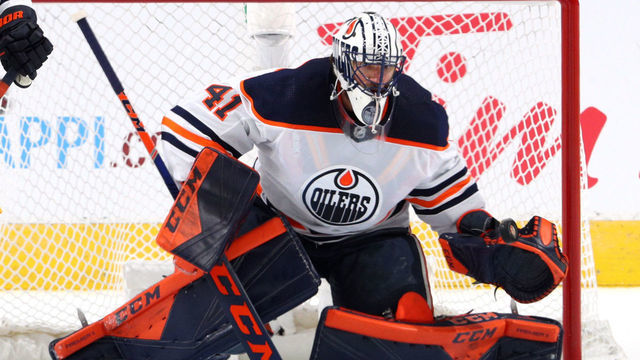 EDMONTON, ALBERTA - JULY 28: Goaltender Mike Smith #41 of the Edmonton Oilers makes a save during the second period of the exhibition game against Calgary Flames prior to the 2020 NHL Stanley Cup Playoffs at Rogers Place on July 28, 2020 in Edmonton, Alberta.