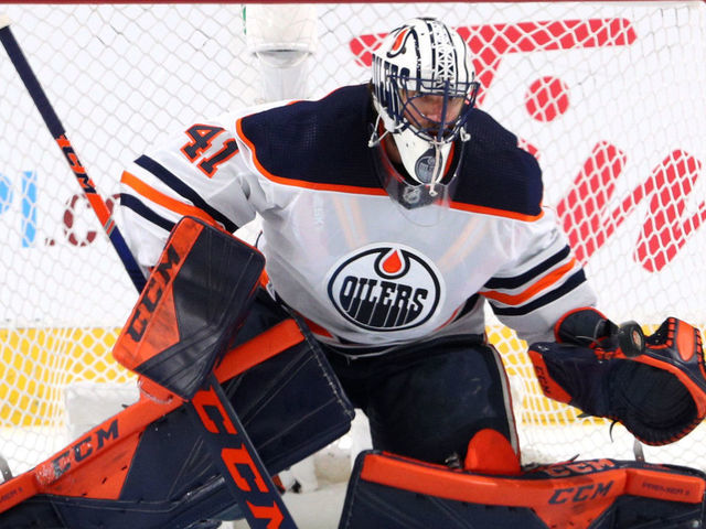 EDMONTON, ALBERTA - JULY 28: Goaltender Mike Smith #41 of the Edmonton Oilers makes a save during the second period of the exhibition game against Calgary Flames prior to the 2020 NHL Stanley Cup Playoffs at Rogers Place on July 28, 2020 in Edmonton, Alberta.