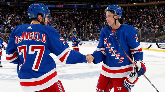 NEW YORK, NY - DECEMBER 27: Ryan Strome #16 and Tony DeAngelo #77 of the New York Rangers celebrate after defeating the Carolina Hurricanes 5-3 at Madison Square Garden on December 27, 2019 in New York City.