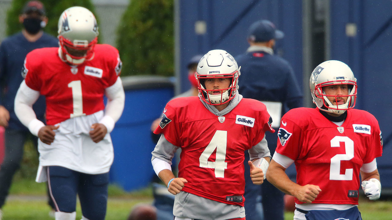 FOXBOROUGH, MA - AUGUST 26: Quarterbacks Cam Newton, left, Jarrett Stidman, center, and Brian Hoyer run a the start of a passing drill at training camp. The New England Patriots hold practice training camp at Gillette Stadium in Foxborough, MA on Aug. 27, 2020.