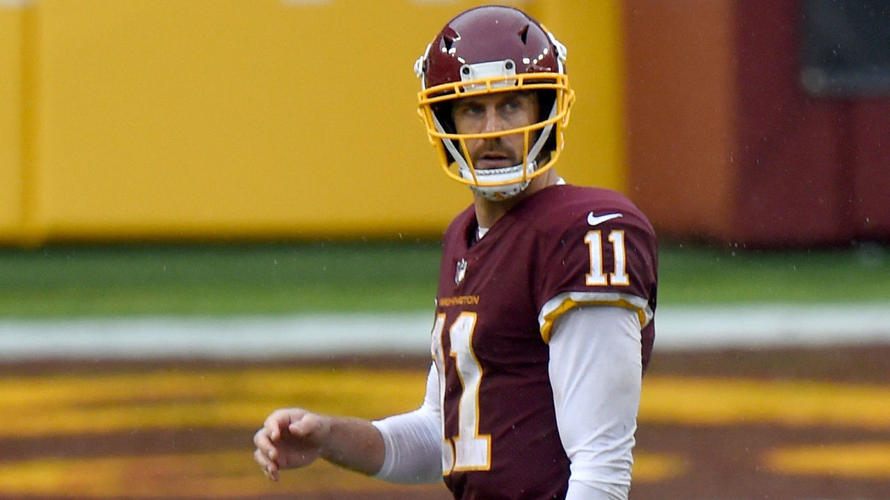 LANDOVER, MD - OCTOBER 11: Alex Smith #11 of the Washington Football Team walks off the field in the fourth quarter against the Los Angeles Rams at FedExField on October 11, 2020 in Landover, Maryland.