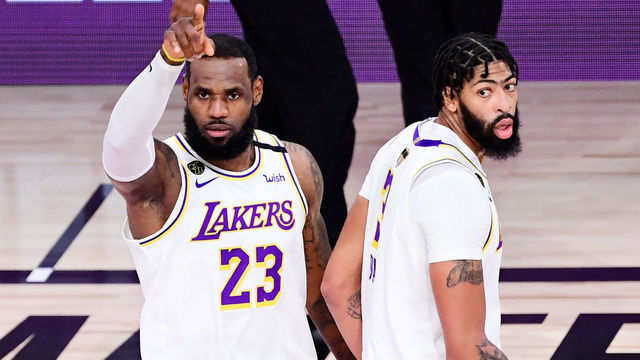 LAKE BUENA VISTA, FLORIDA - OCTOBER 11: LeBron James #23 of the Los Angeles Lakers and Anthony Davis #3 of the Los Angeles Lakers react during the second quarter against the Miami Heat in Game Six of the 2020 NBA Finals at AdventHealth Arena at the ESPN Wide World Of Sports Complex on October 11, 2020 in Lake Buena Vista, Florida.