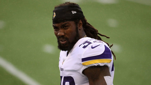 SEATTLE, WASHINGTON - OCTOBER 11: Dalvin Cook #33 of the Minnesota Vikings looks on in the rain before the start of a game against the Seattle Seahawks at CenturyLink Field on October 11, 2020 in Seattle, Washington.